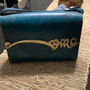 A beautiful deep turquoise leather bag